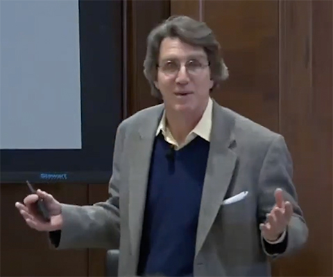 Ed Eisenstein interacts with the audience at a 2019 science café.