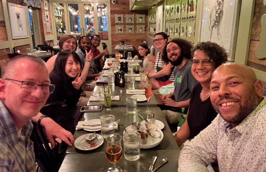 Blanton Tolbert and his lab gather for a group dinner celebration.