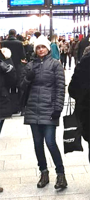 Sephra Rampersad waits at a train station during her visit to the UK.