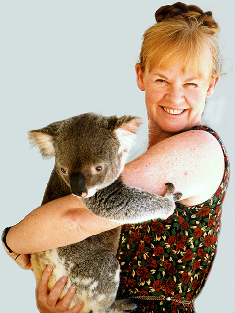 A younger Jenny Graves hugs a koala.