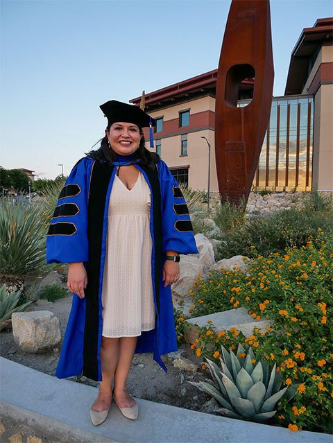 Crystal Mendoza earned her Ph.D. during the COVID-19 pandemic lockdown, so she posed for graduation photos in her hometown of El Paso, Texas instead of on the campus at the Mayo Clinic.