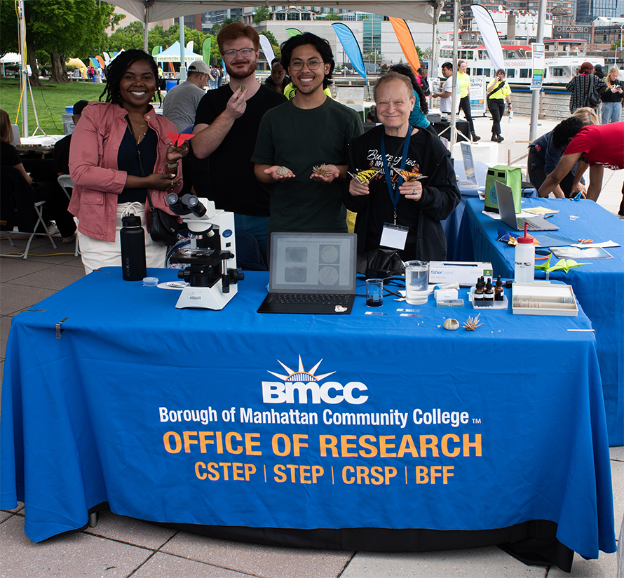 Pollard, left, and other representatives of the Borough of Manhattan Community College man an informational table in Battery Park, New York City.