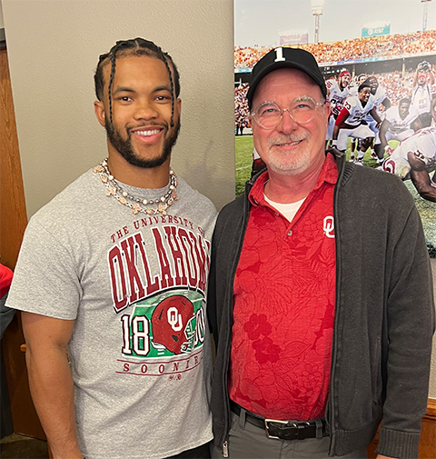 John Peters, right, stands with Kyler Murray, 2018 Heisman Award winner for the Oklahoma Sooners, at an OU function. Murray is now the quarterback for the Arizona Cardinals.