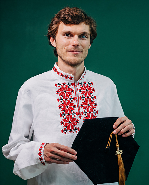 Maksim Dolmat graduated from the University of Alabama at Birmingham, wearing his doctoral cap and gown over traditional Belarusian clothing.