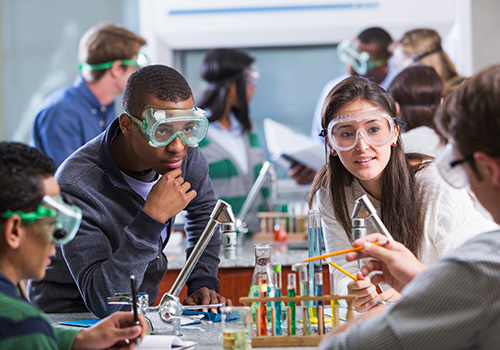 stock photo of students with test tubes