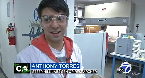 Anthony Torres being interviewed in lab on TV.