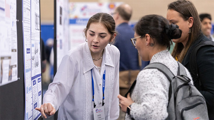 Student presenting a poster