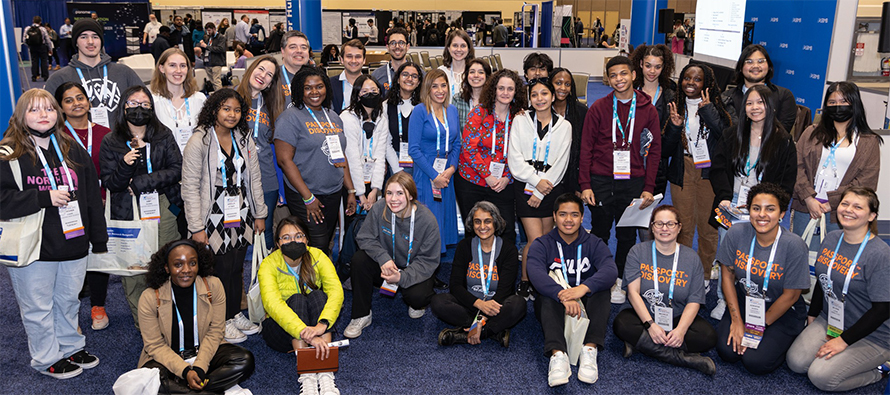 Community Day high school participants and volunteers pose for a group photos at Discover BMB Seattle 2023.