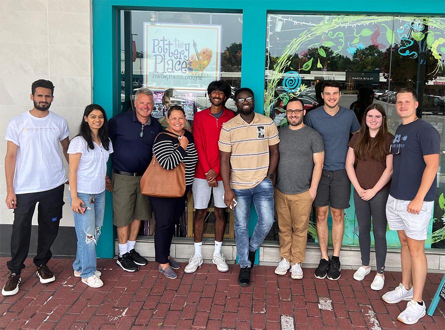 Humphrey Omeoga, center, and his lab mates enjoy eating out together and sharing the cuisines of their native countries, including Nigeria, India, Germany, Iran and the U.S.