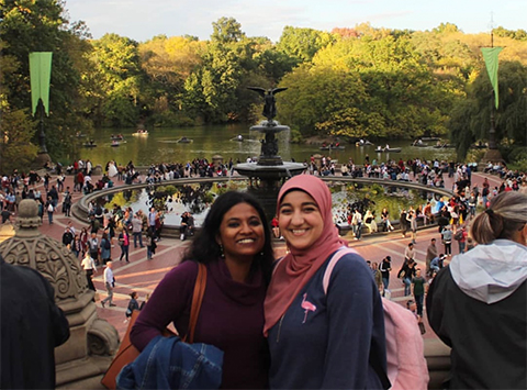 Krishnakoli Adhikary stands with Elshaimaa Ali, a friend from Egypt, in front of a fountain in Central Park in 2019.